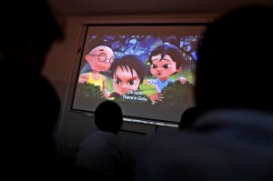 Pakistani orphans watch an early screening of the first episode of the animate Burka Avenger Series, at an orphanage on the outskirts of Islamabad, Pakistan on March 25, 2013. (Muhammed Muheisen/AP)